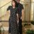 Couple wearing matching black cotton Bagru print Anarkali dress and shirt set