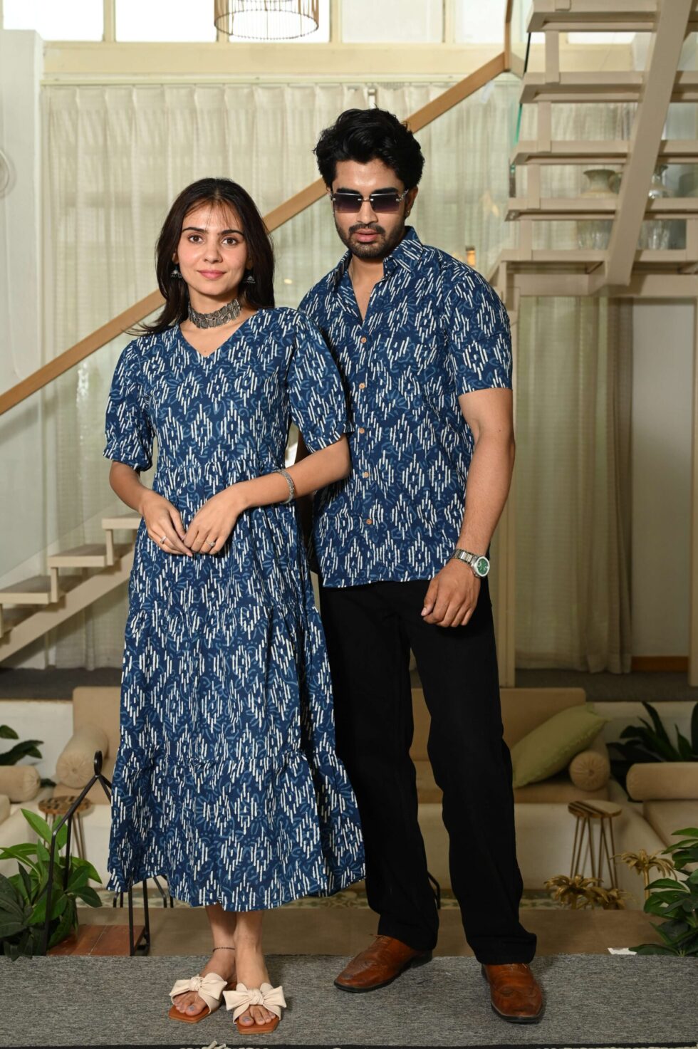 Woman in blue Ikat Anarkali midi dress with traditional Indian print