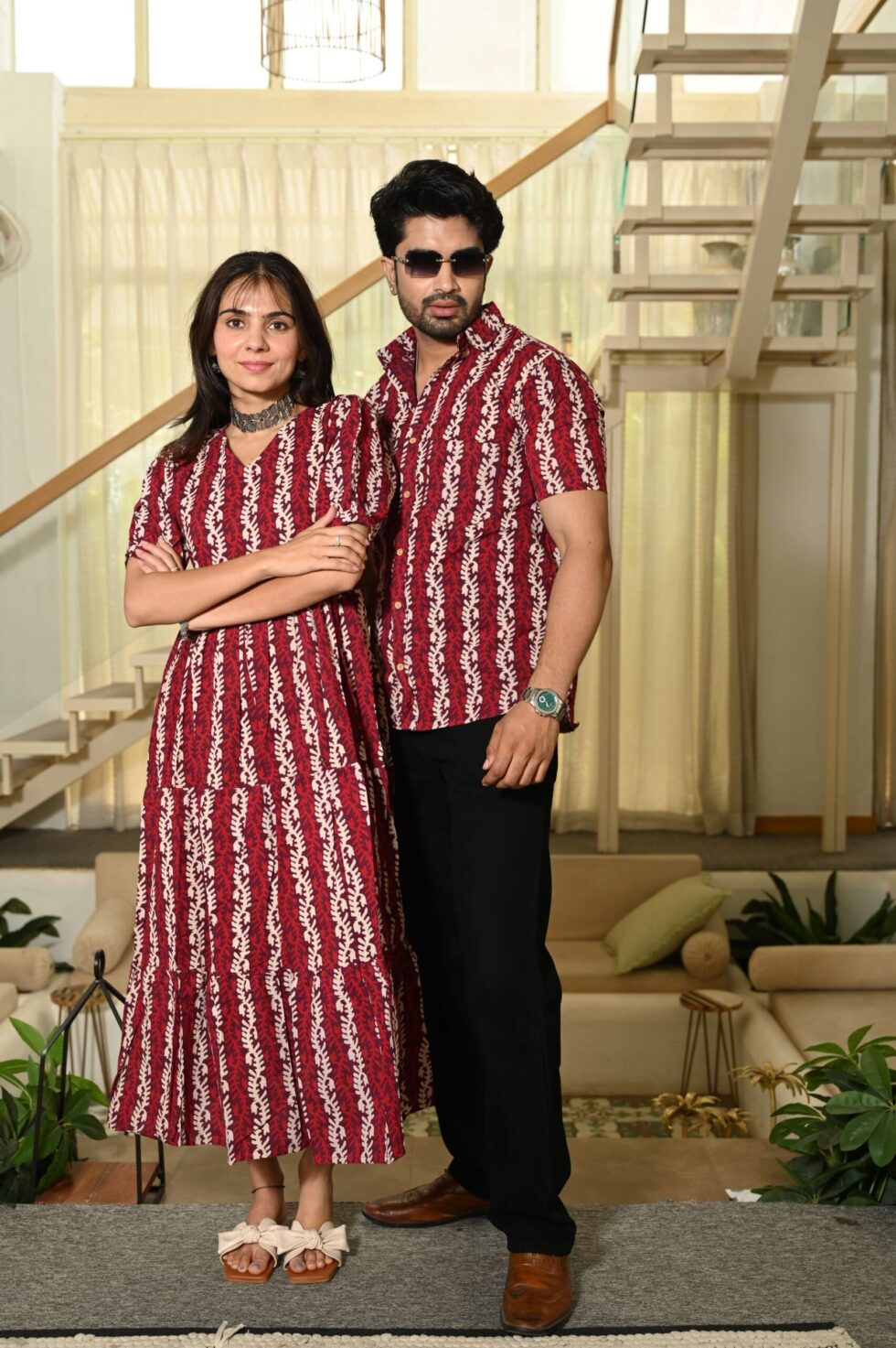 Couple wearing matching red vertical vine Bagru block print Anarkali and shirt set