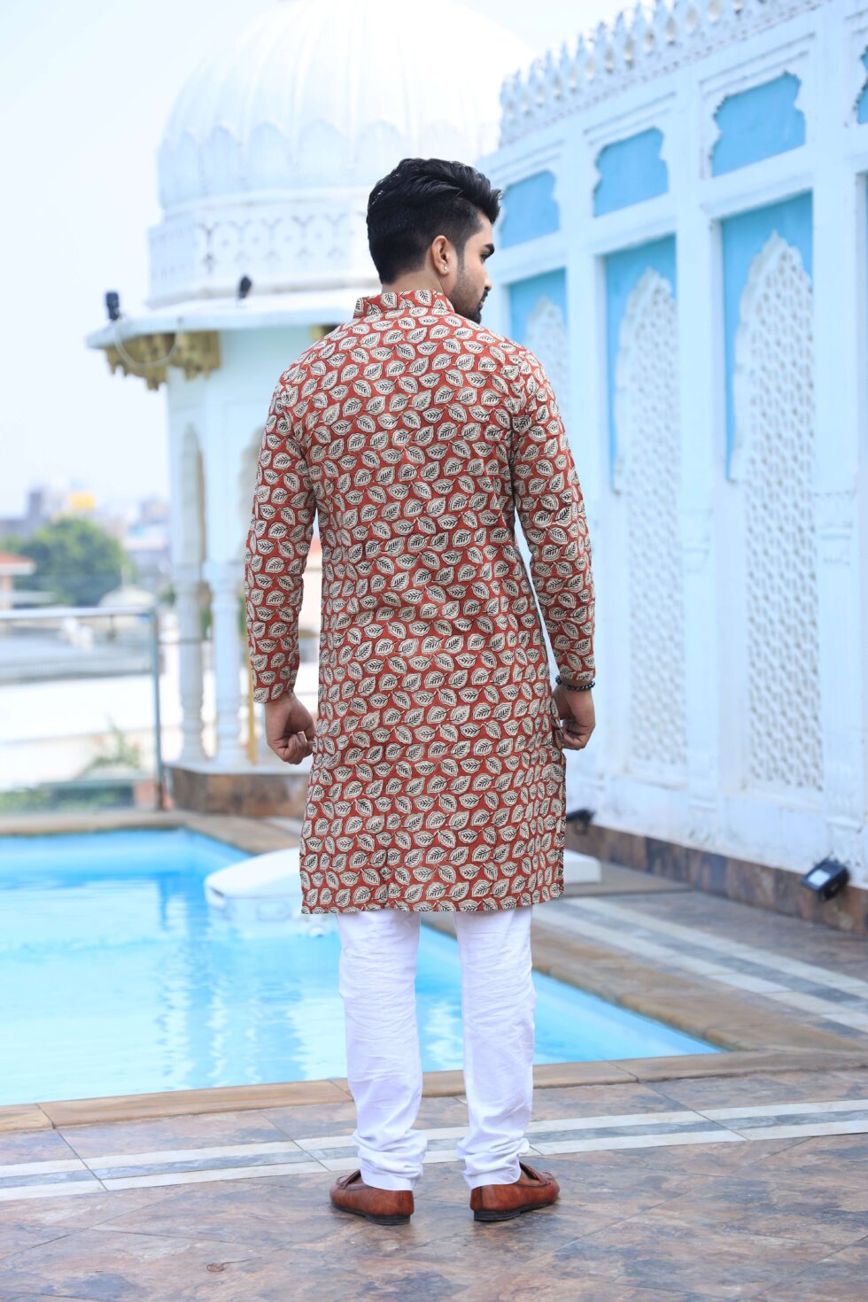 Close-up of the detailed ethnic print on the beige cotton fabric