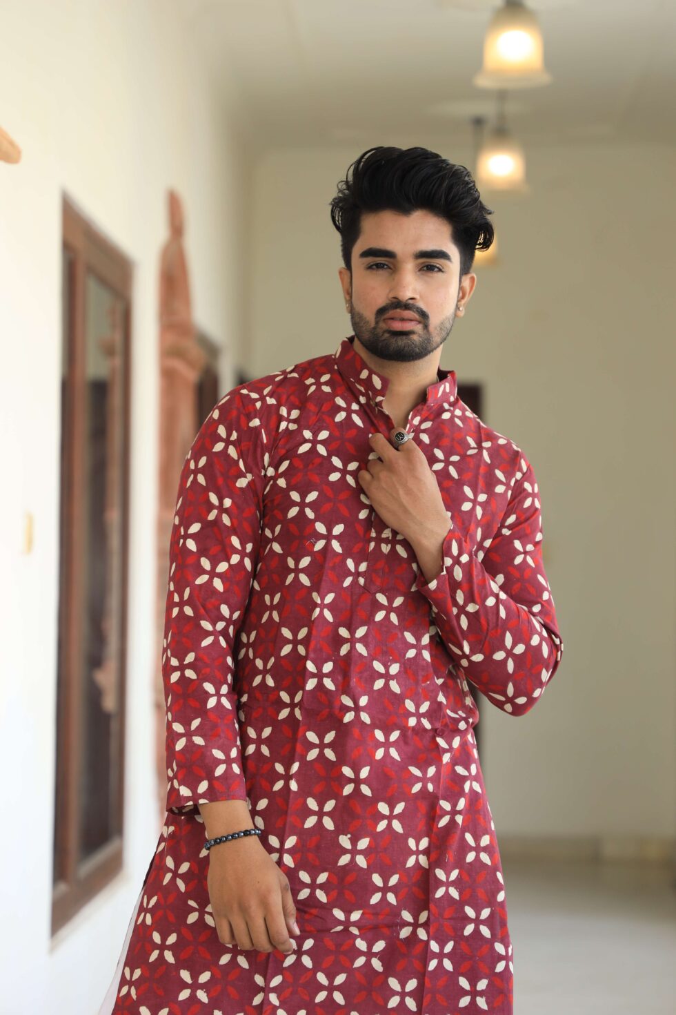 Detailed shot of the artisan's craftsmanship on the kurta