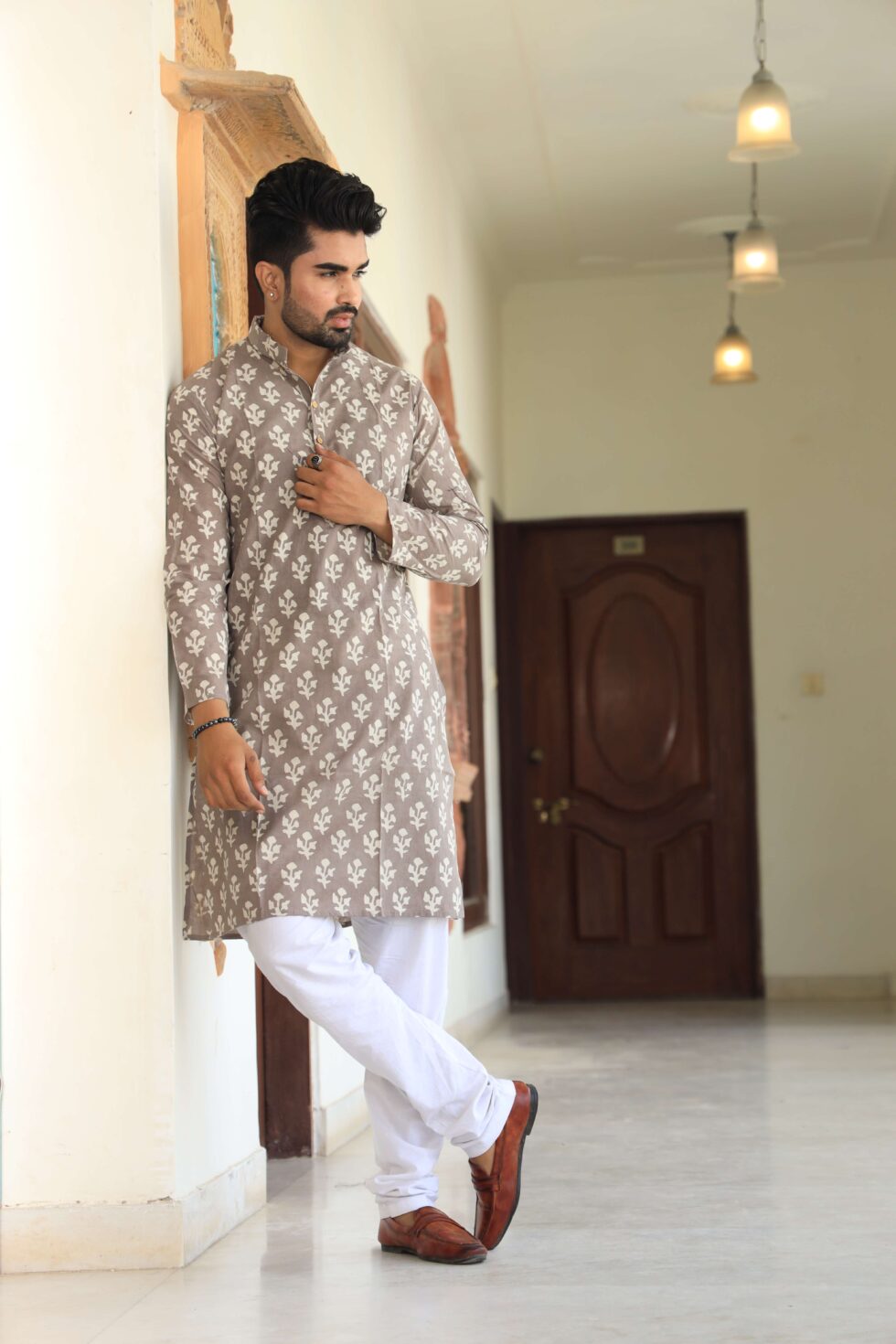 Model wearing maroon kurta set with white pajama