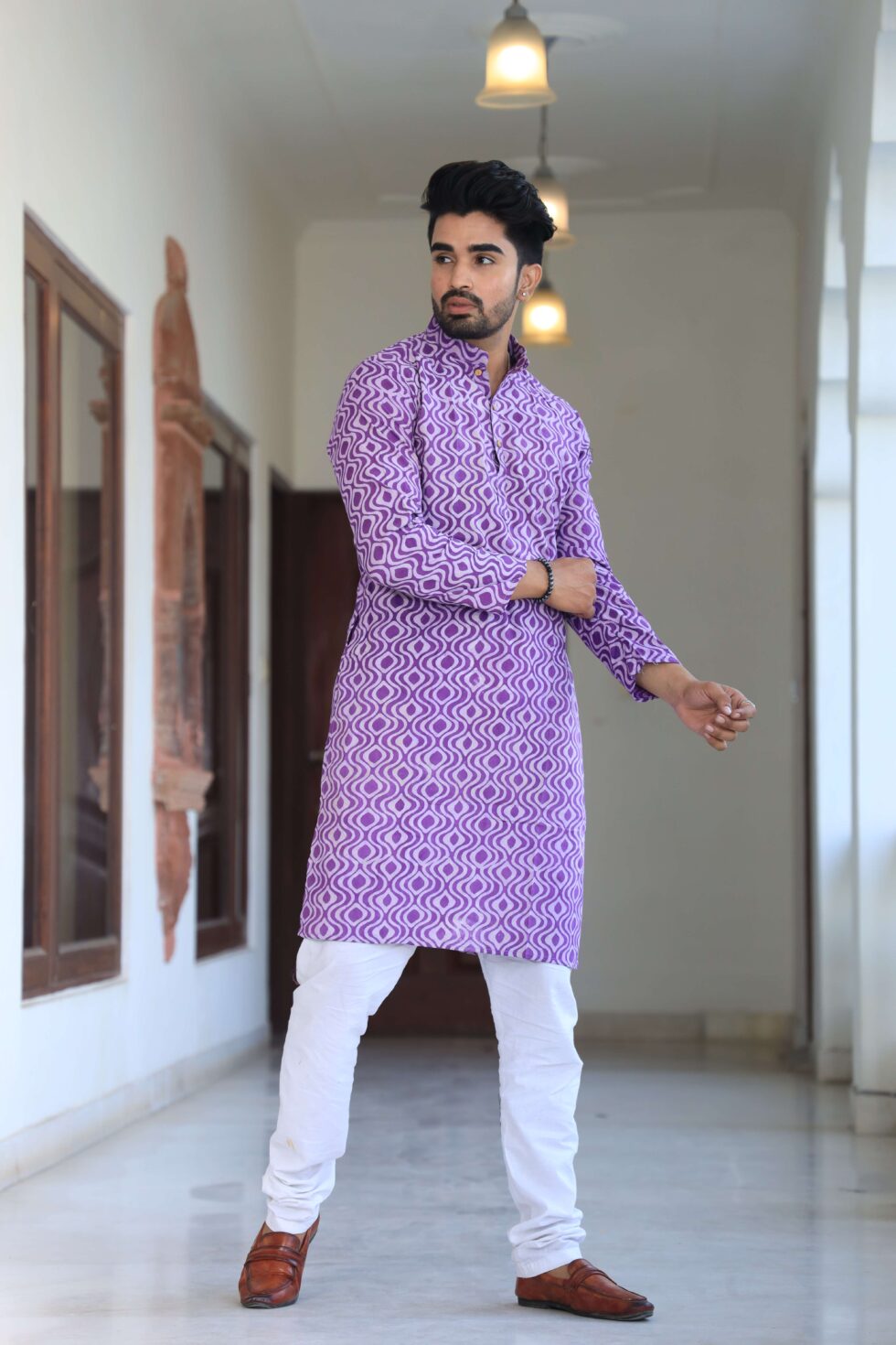 Model wearing the Men's Purple Kurta Set, showcasing its comfort and style