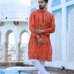 Orange printed kurta with traditional Indian motifs