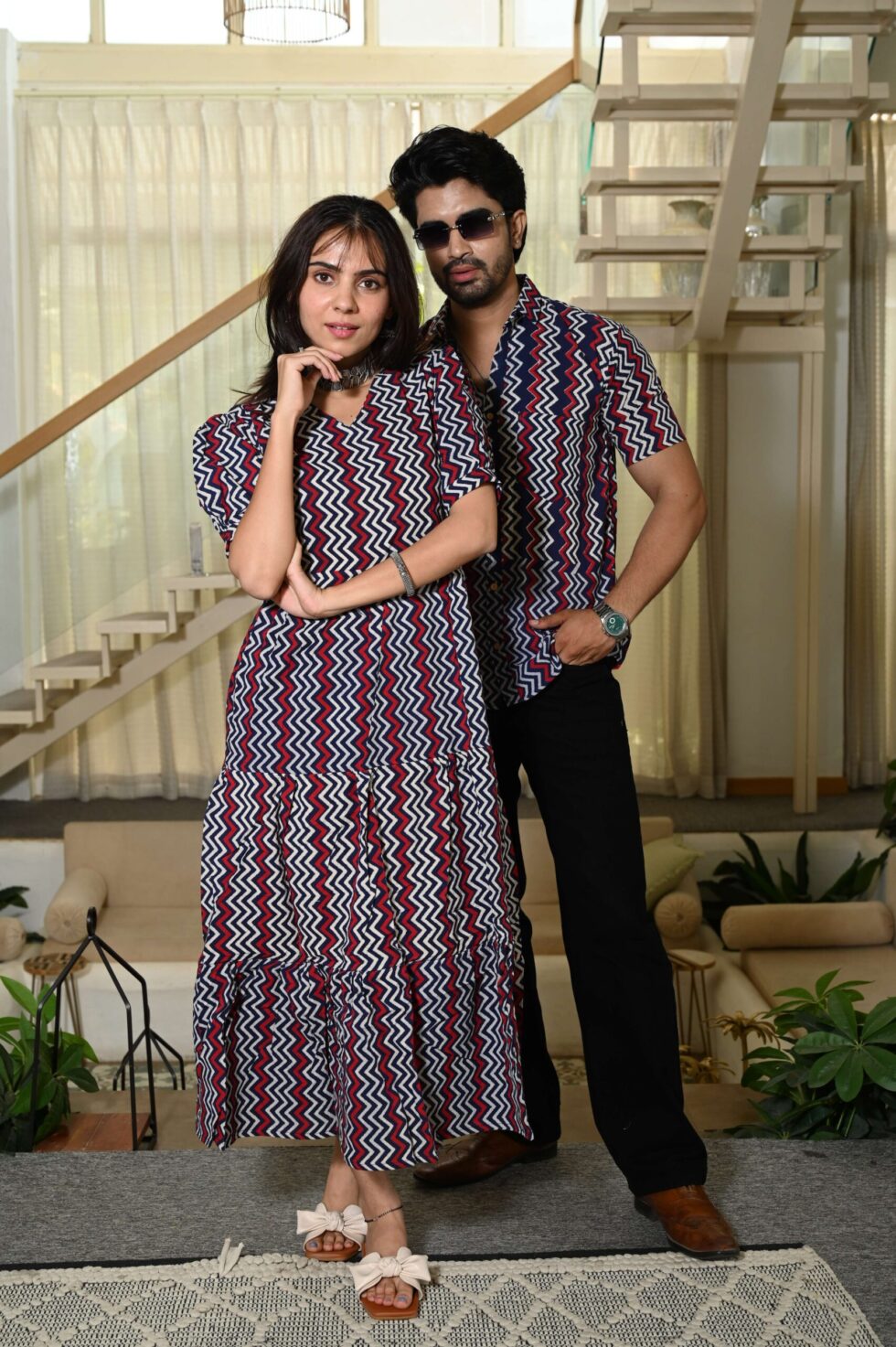 Man and woman posing in matching ethnic Bagru print outfits for festive celebrations