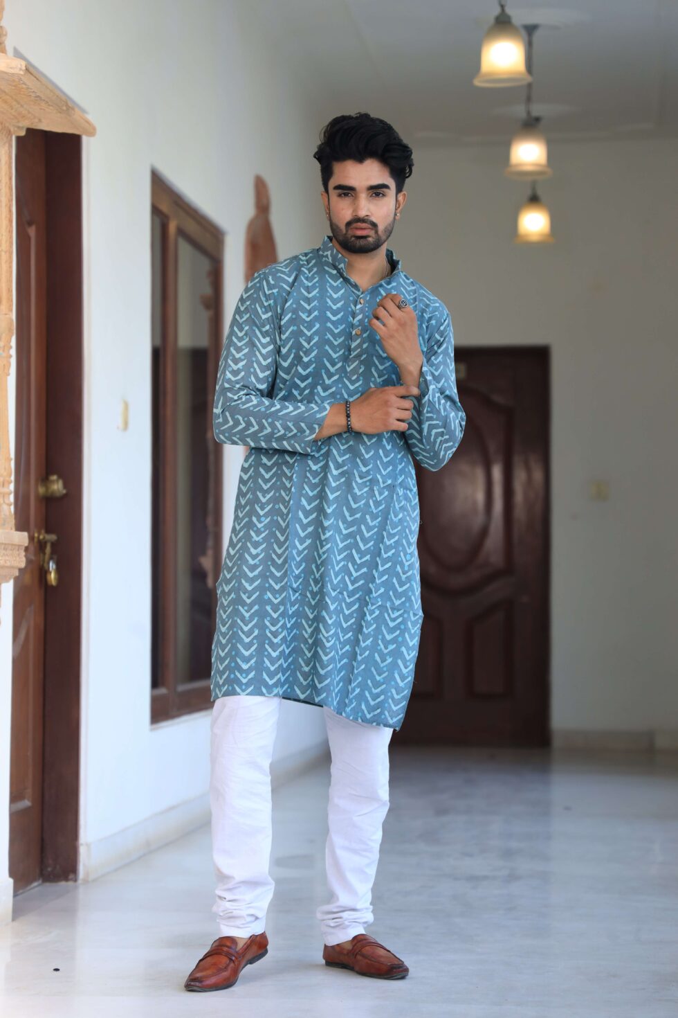 Artisan at work, handcrafting the Mens Kurta Set with precision and love