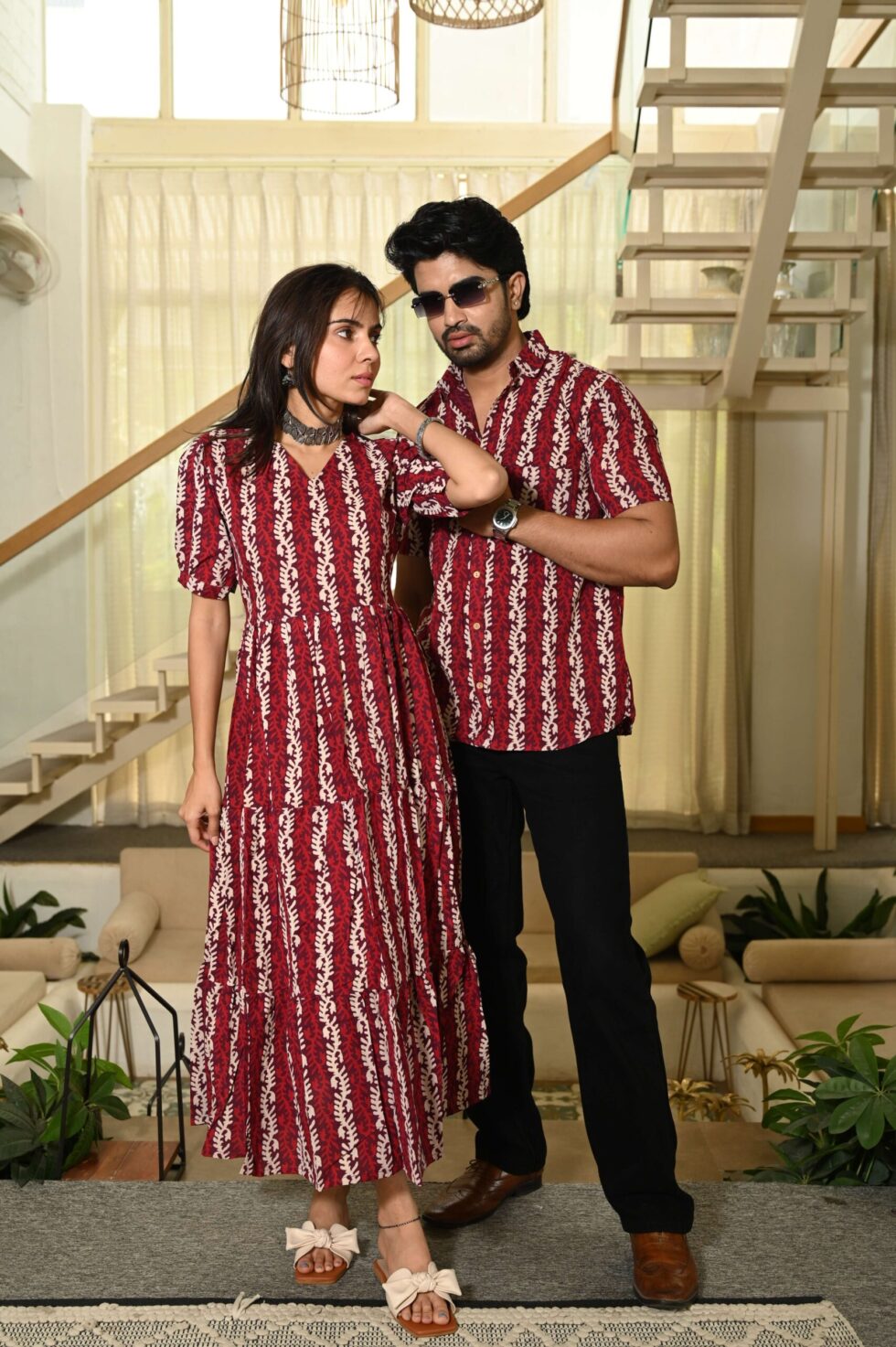 Woman wearing a premium red Anarkali midi dress with traditional Indian block prints