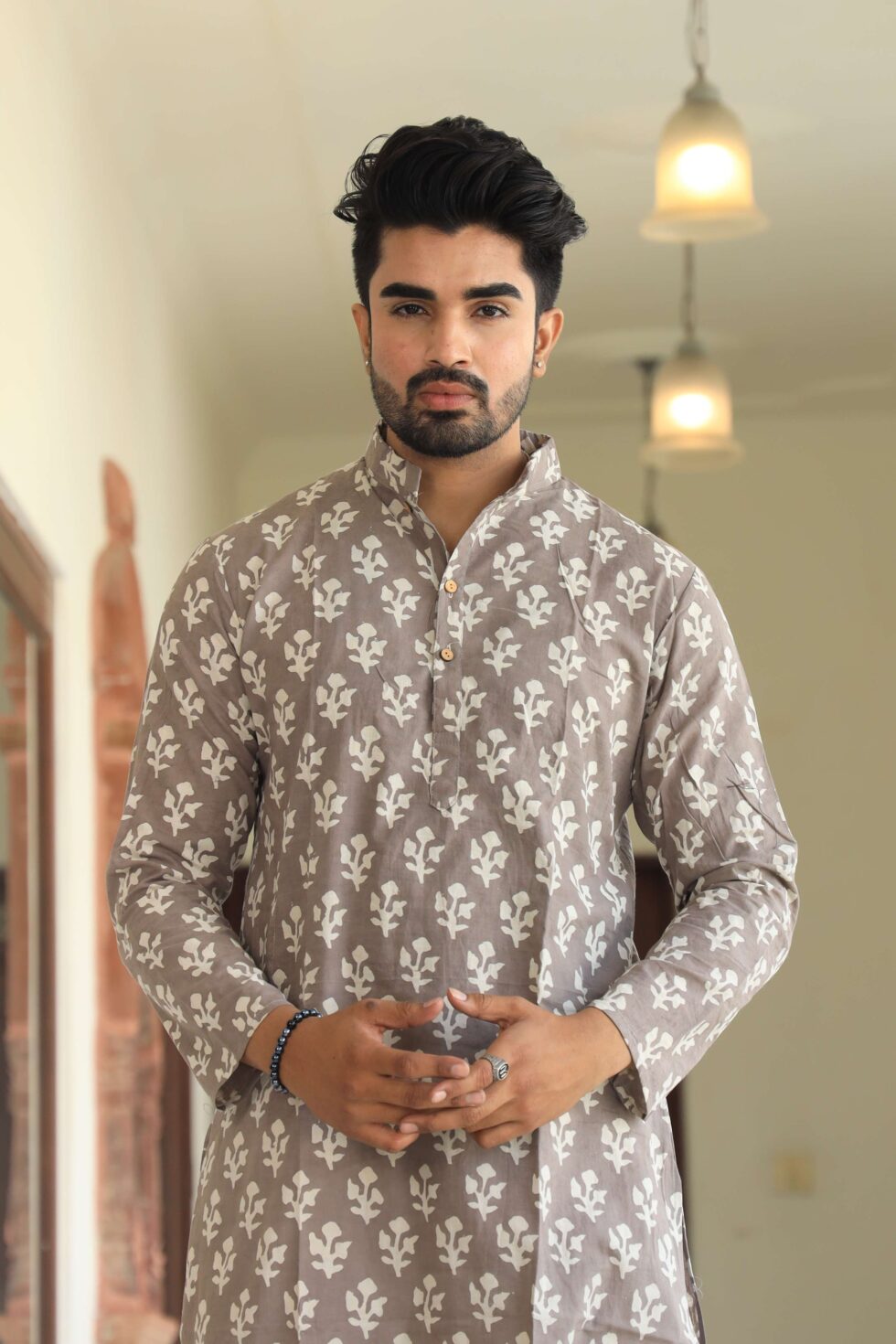 Kurta set with white pajama and maroon kurta folded