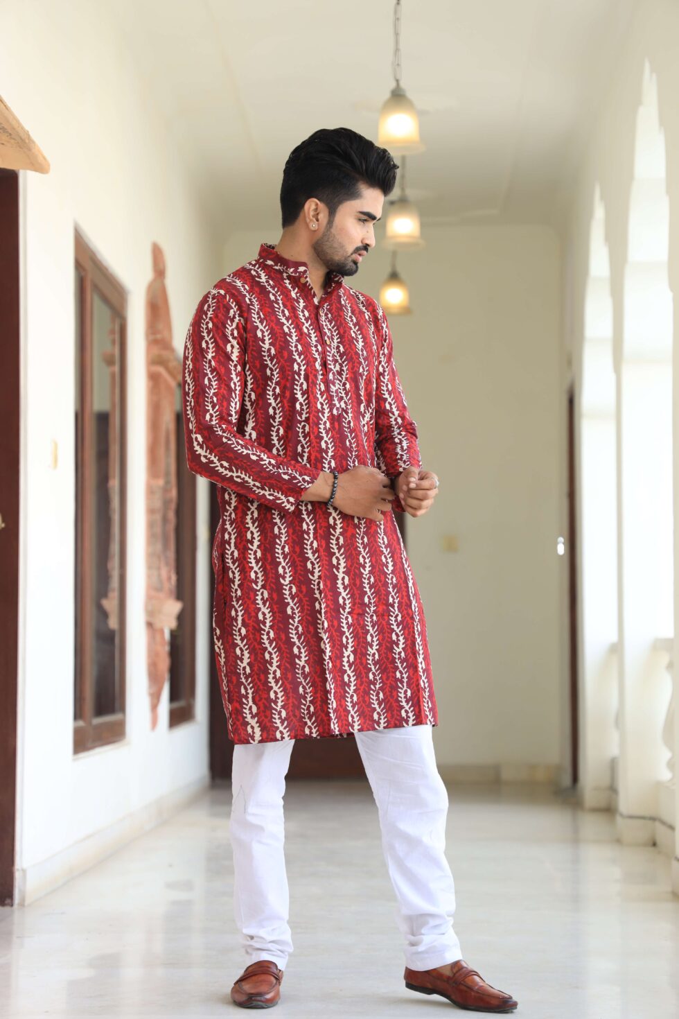 Model wearing Men's Kurta Set with traditional accessories