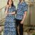 Couple wearing matching Jivanta Artifex Blue Leaf Bagru Print Anarkali dress and Men's shirt