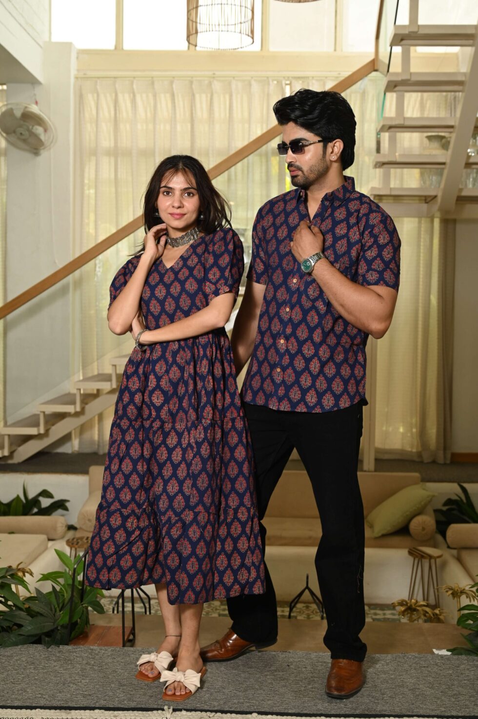 Detailed view of red Bagru hand block floral patterns on navy blue cotton fabric