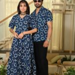 Couple posing in matching navy blue Bagru print cotton Anarkali dress and shirt set