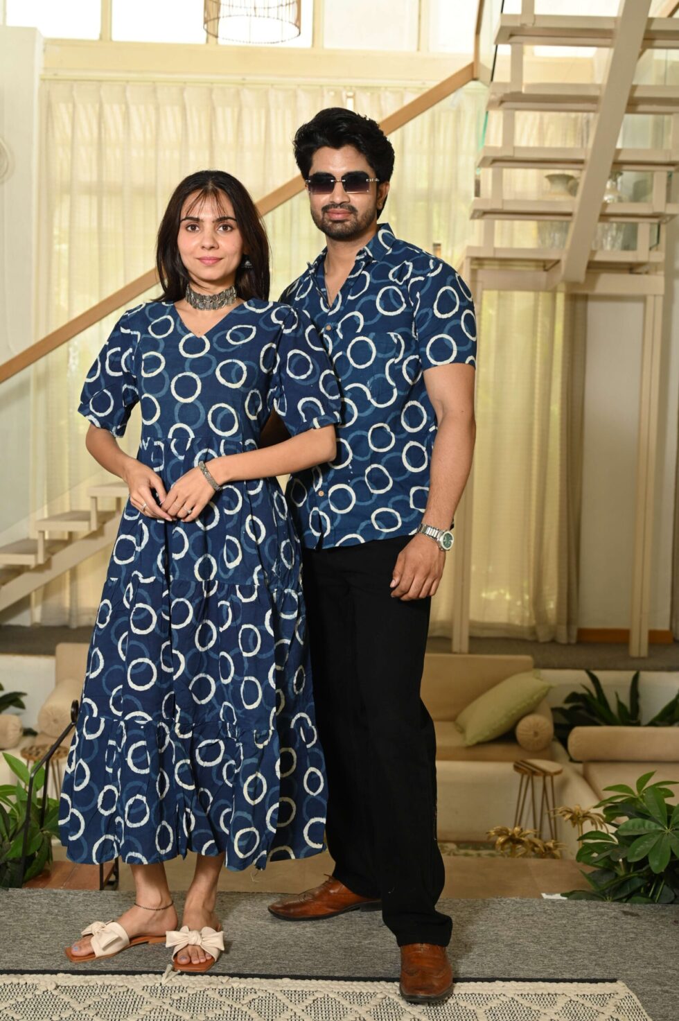 Couple posing in matching navy blue Bagru print cotton Anarkali dress and shirt set