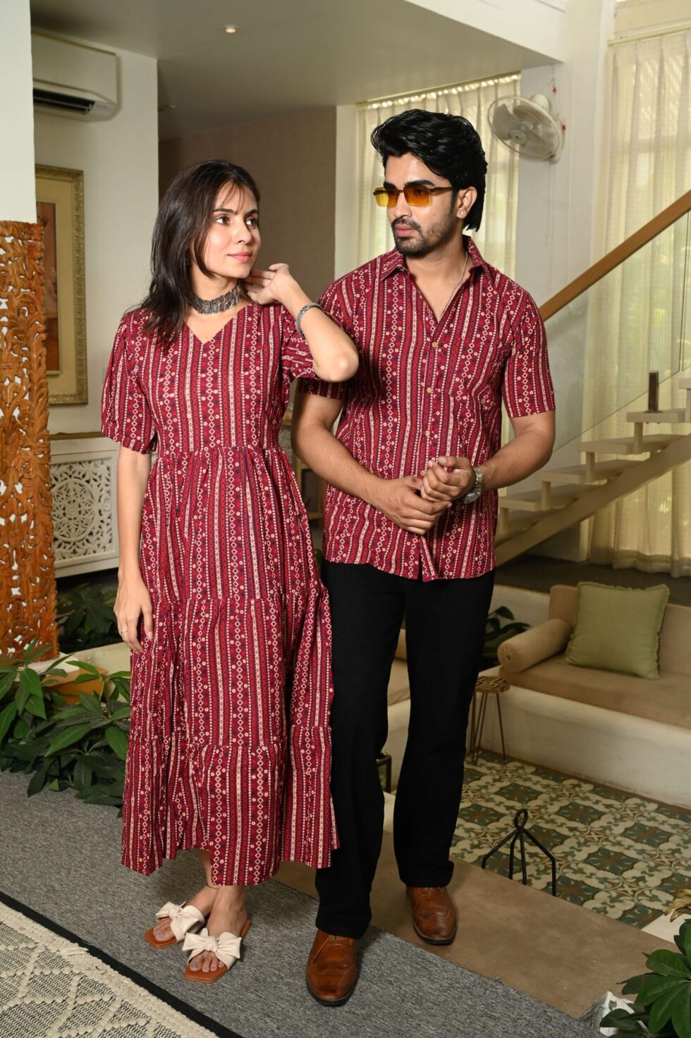 Couple wearing the matching Anarkali dress and shirt set, posing together